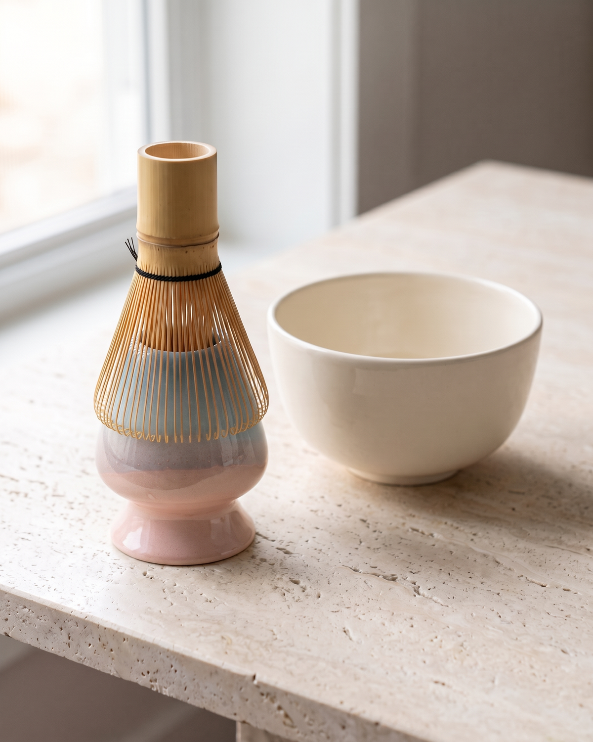In use: Two-Tone Ceramic Whisk Holder – Blue Pink Dip, bamboo whisk resting prongs-down on the holder to dry