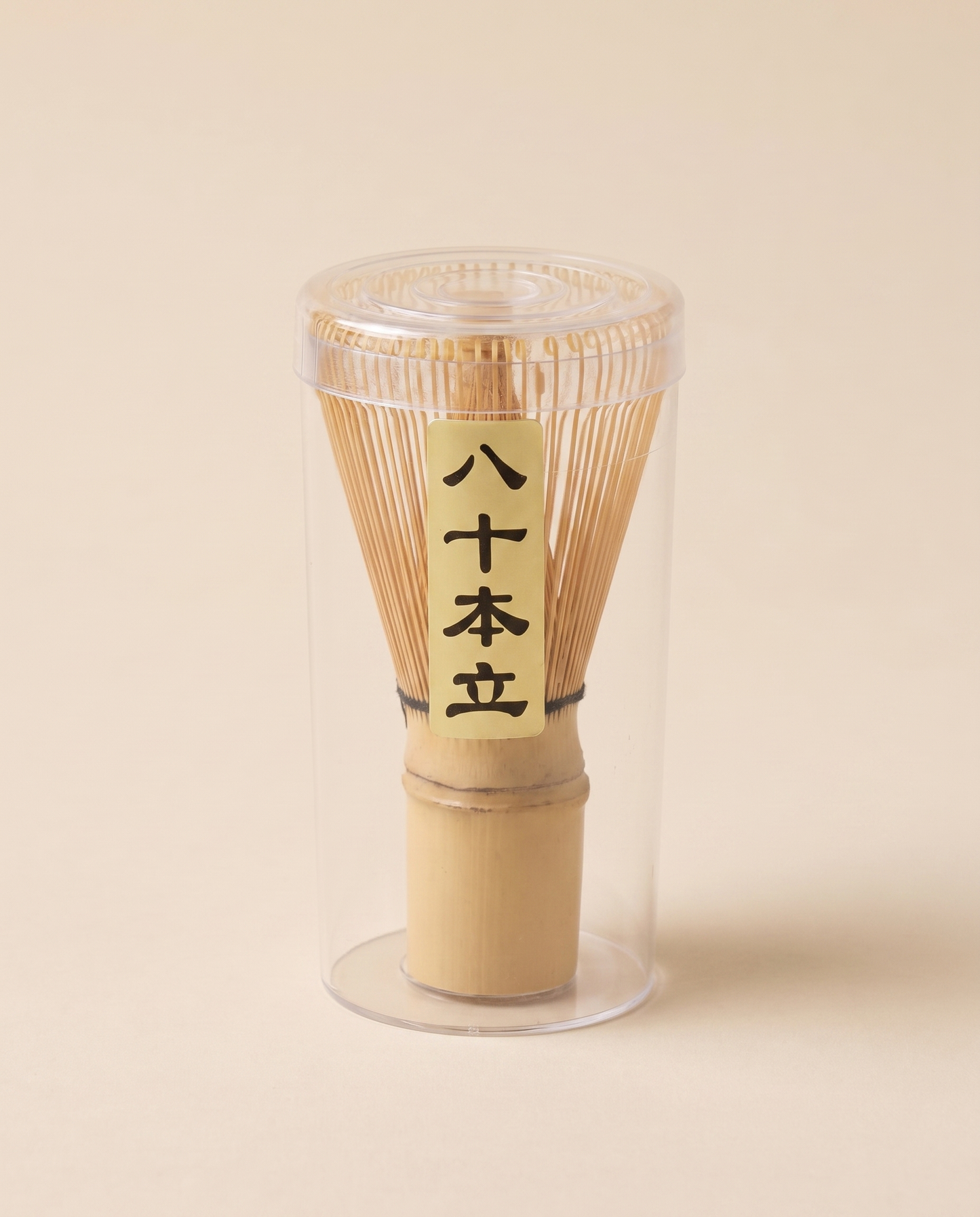 What arrives: the whisk in its clear protective tube, with the maker's paper label on the handle