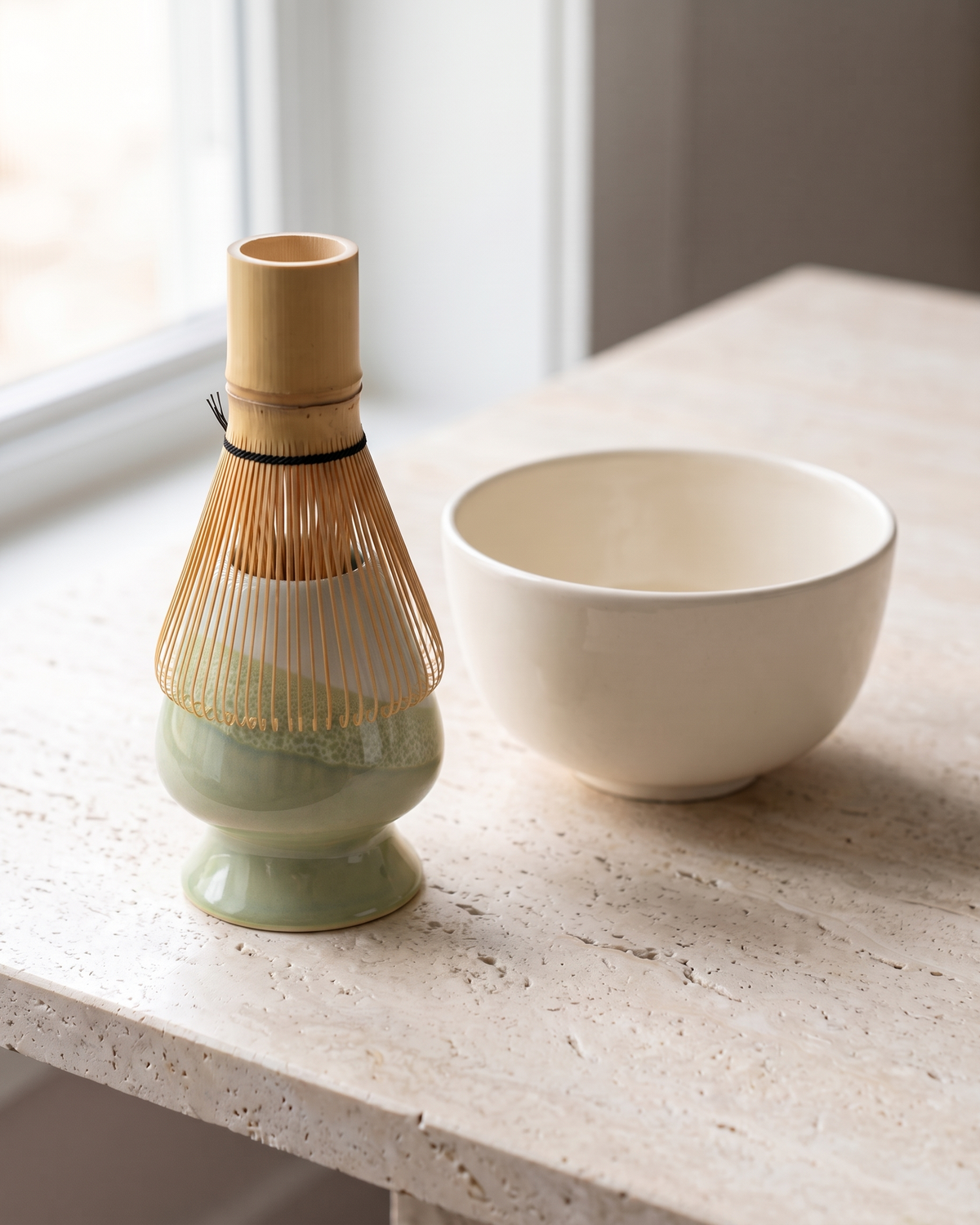 In use: Two-Tone Ceramic Whisk Holder – Green Dip, bamboo whisk resting prongs-down on the holder to dry