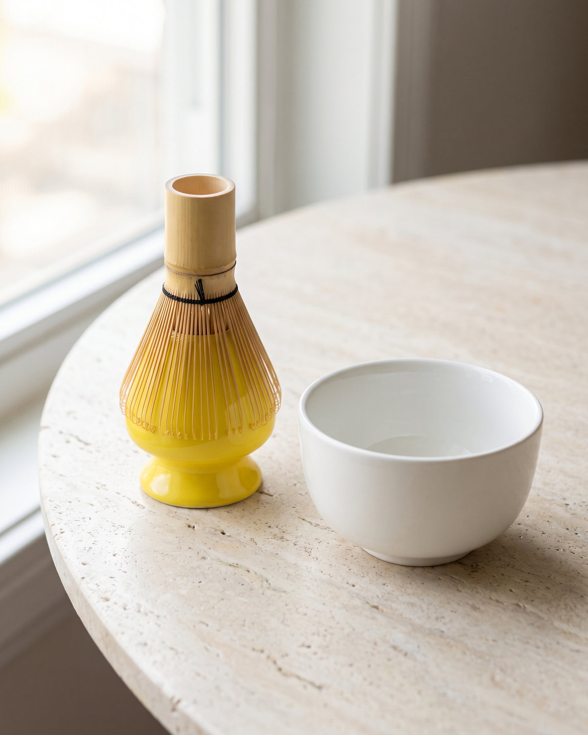 In use: Glossy Ceramic Whisk Holder – Yellow, bamboo whisk resting prongs-down on the holder to dry