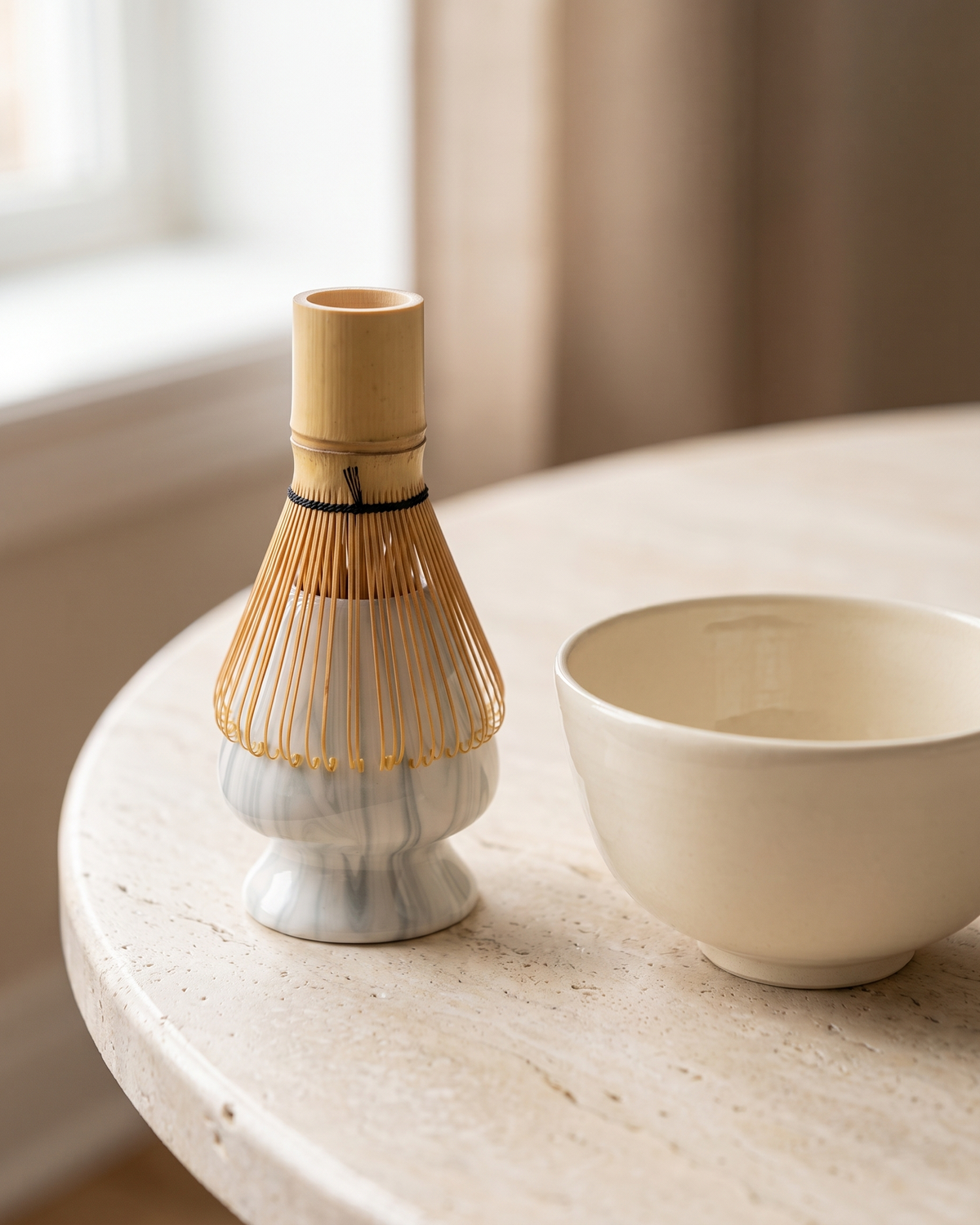 In use: Marble Ceramic Whisk Holder – Marble Grey, bamboo whisk resting prongs-down on the holder to dry