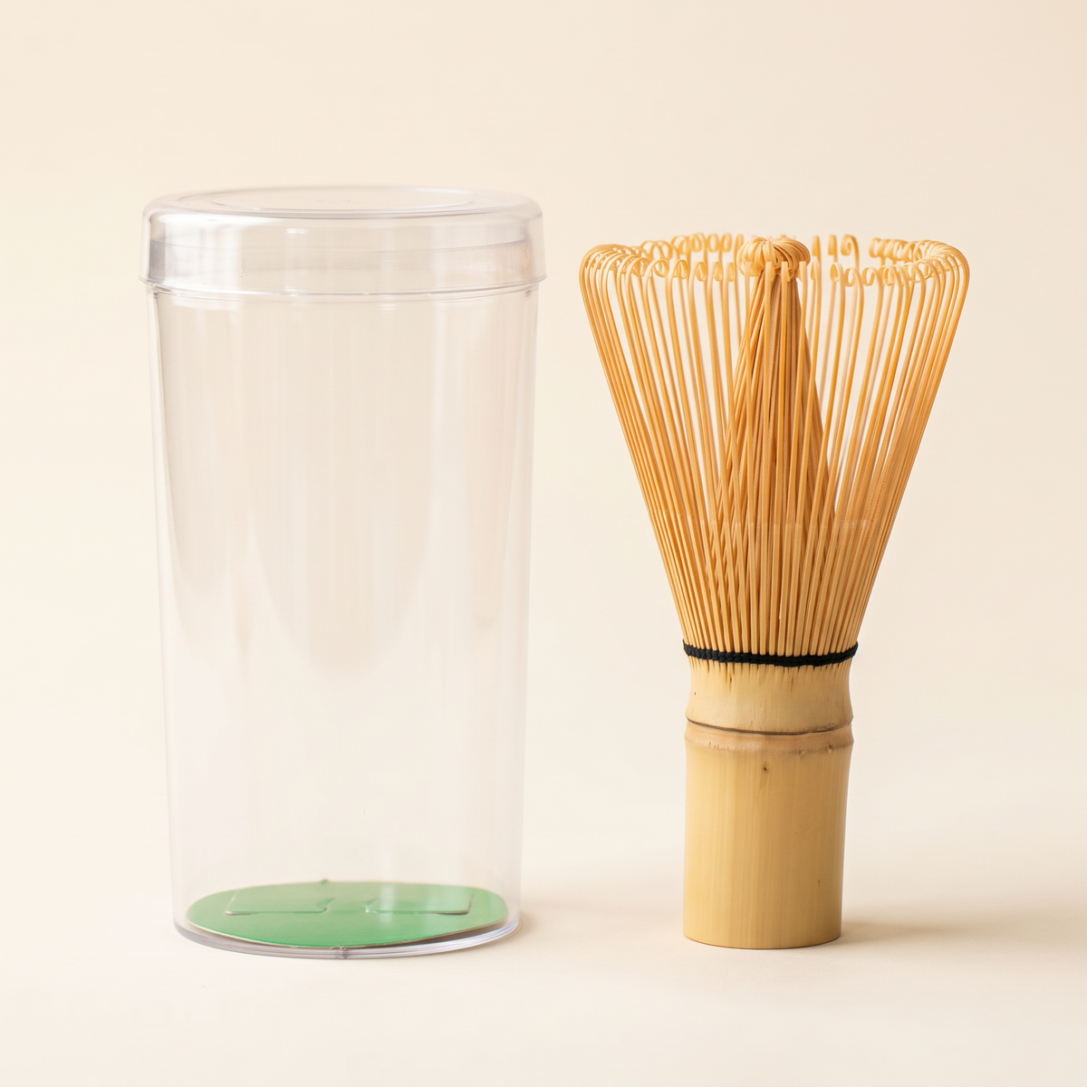 What arrives: the 70-prong whisk beside its clear protective tube, shown without its label