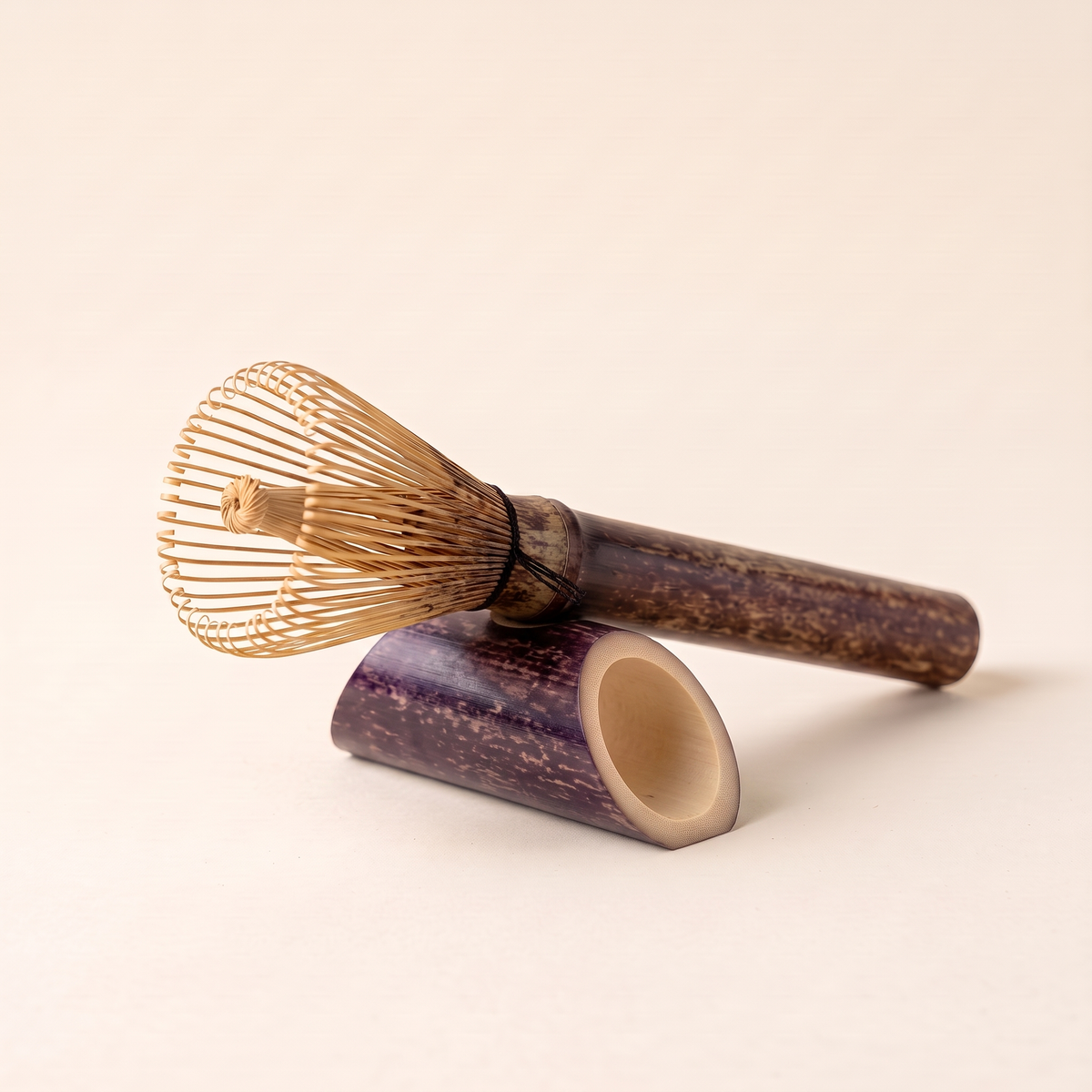 Long-handle bamboo whisk resting on its short bamboo stand