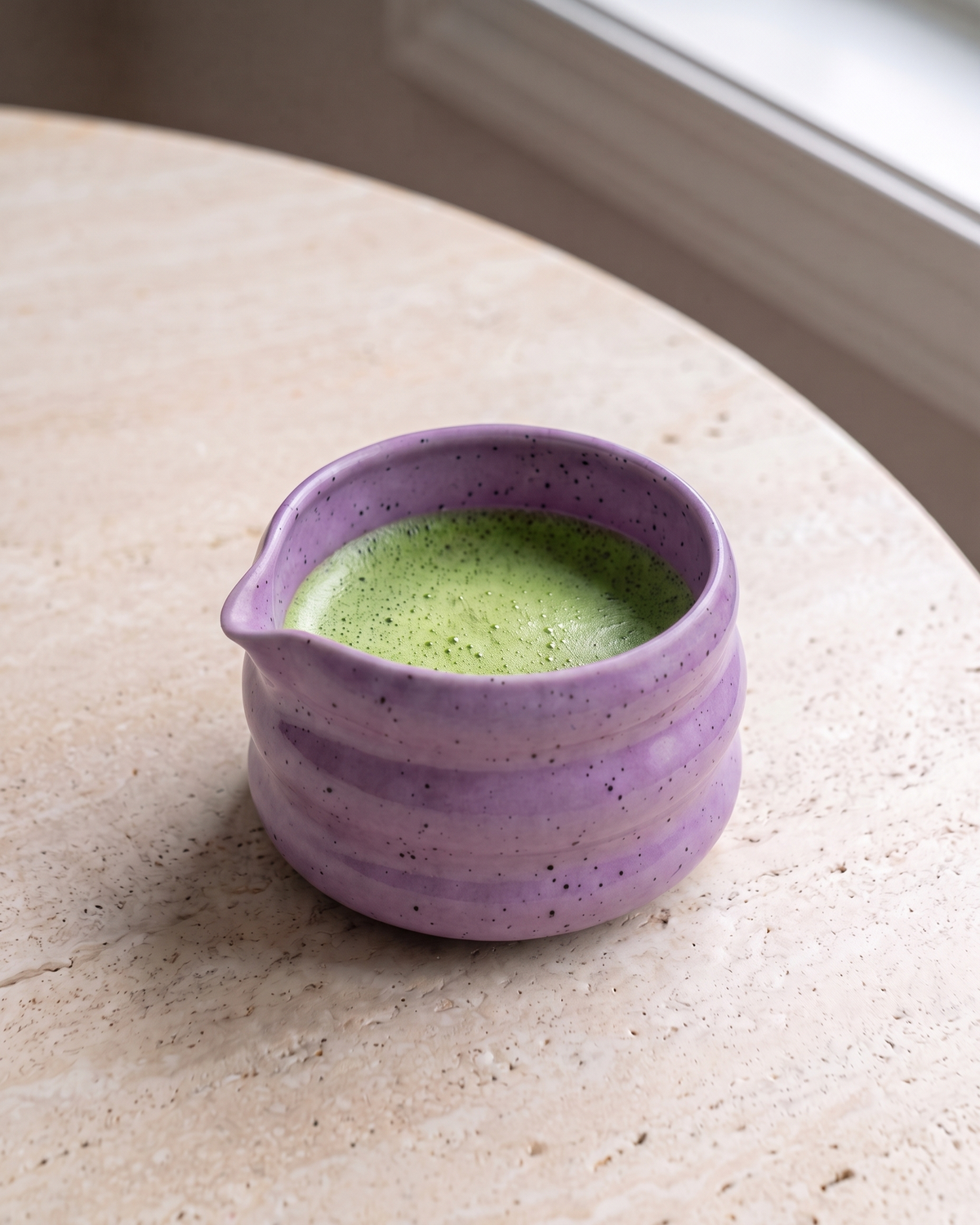 In use: Speckled Ceramic Matcha Bowl – Purple, filled with freshly whisked matcha
